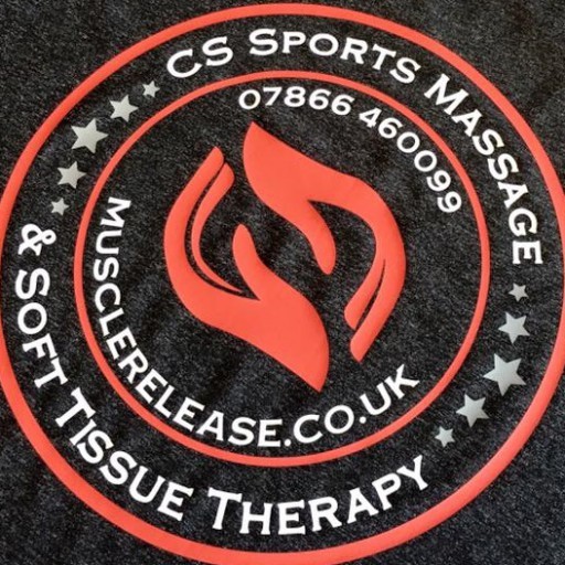 CS Sports Massage & Soft Tissue Therapy badge, photographed on charcoal cloth